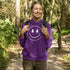 Introducing the latest in outdoor fashion and forest friendliness: the "Tree-mendous Smiles Hoodie"! This isn't just any hoodie; it's your ticket to becoming the most smiley face in the wild. With a dazzling happy face emblazoned on the front, you're set to spread joy among the trees, the birds, and even the most stubborn of rocks.